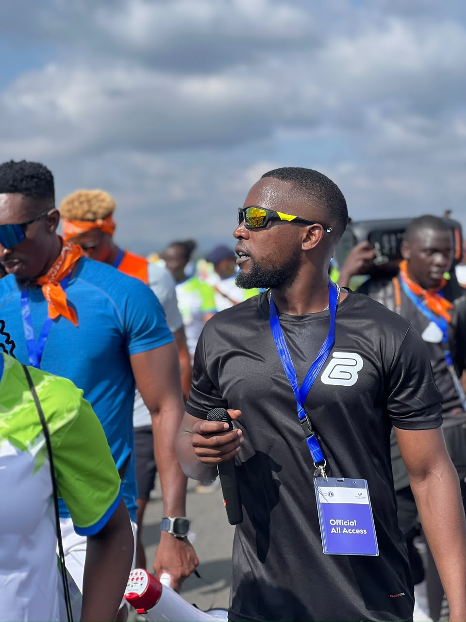 Dance Connect host holding microphone at Standard Chartered Marathon 2025