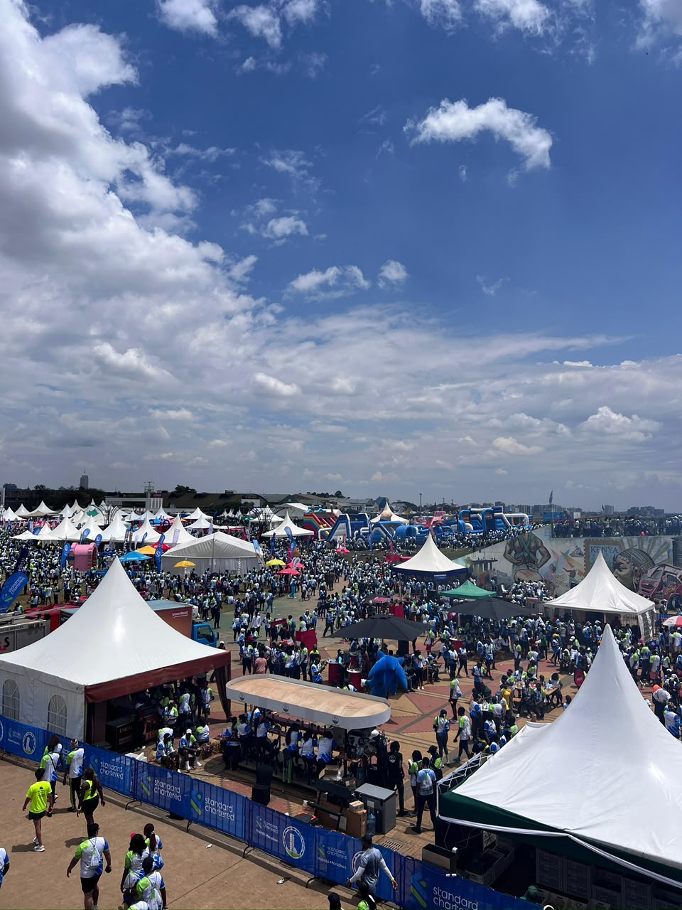 Wide event village view at Standard Chartered Marathon 2025